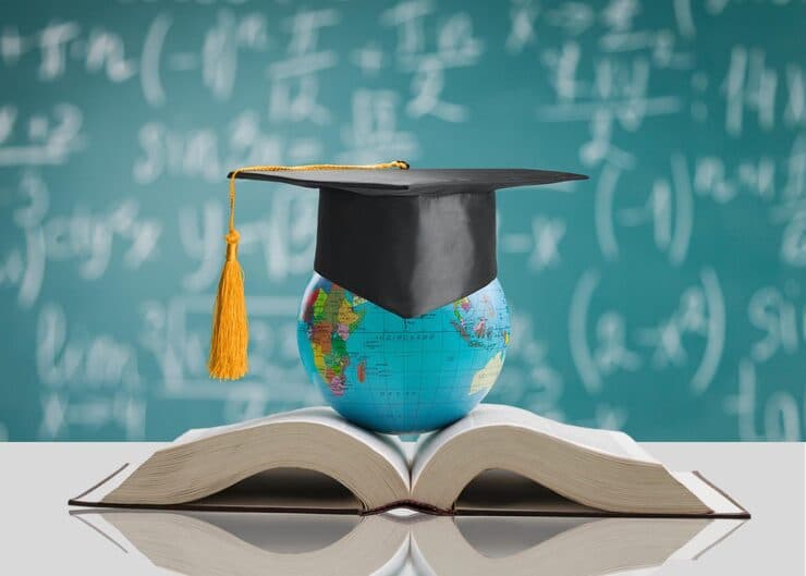 Student studying with globe and books